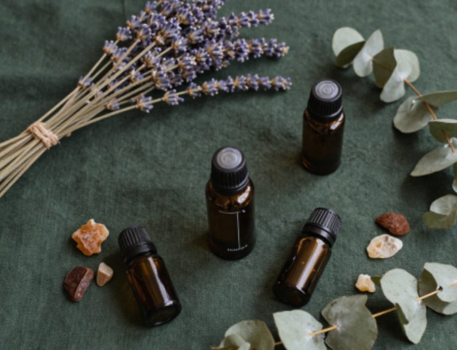 Lavender and essential oil bottles on linen — Still Earth Living dilution guide